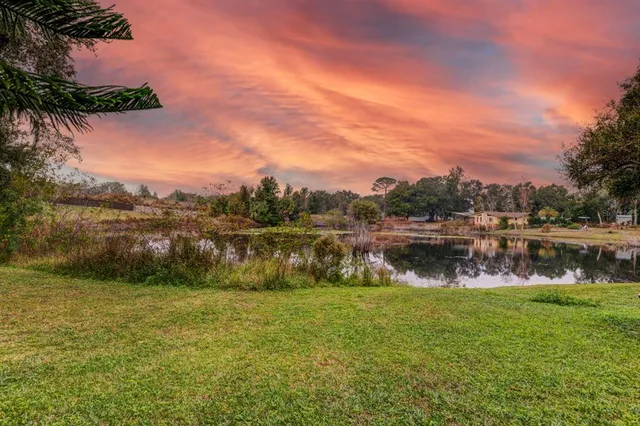 a view of lake with green space