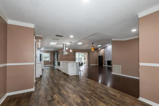 a view of kitchen with cabinets and wooden floor