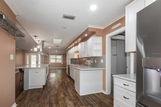 a view of a kitchen and utility room