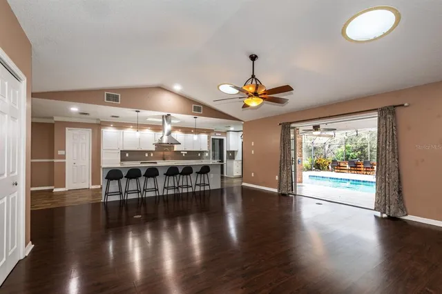 an open kitchen with a table and chairs