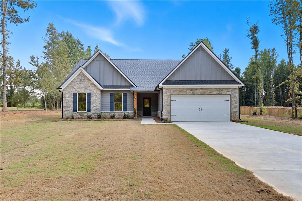 a front view of house with yard and trees