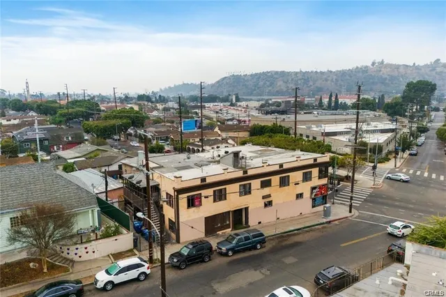 a view of a city that has lawn chairs and a table