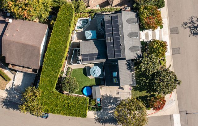 an aerial view of residential houses with outdoor space