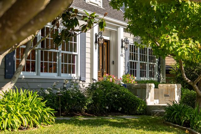 a front view of a house with a yard