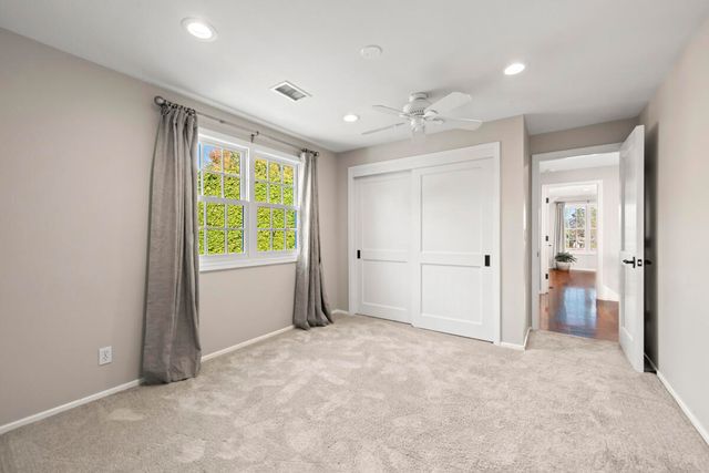 an entryway to room with windows