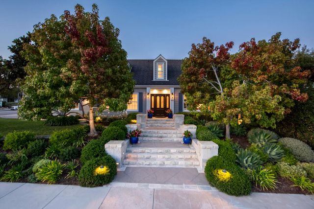 a front view of a house with garden