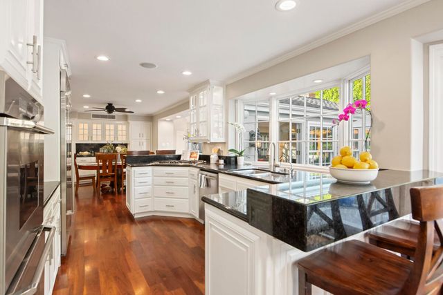 a kitchen with a sink microwave and refrigerator