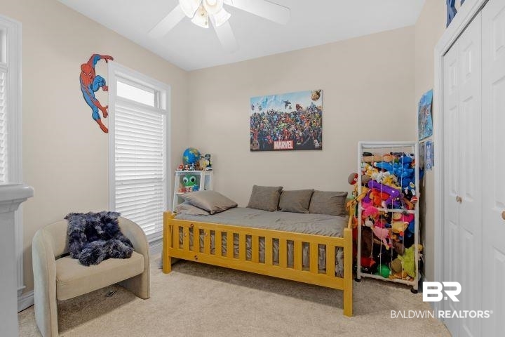 24541 Baldwin Beach Expressway Robertsdale, AL 36567 - Photo 22 of 51 Bedroom featuring carpet flooring, a closet, and ceiling fan