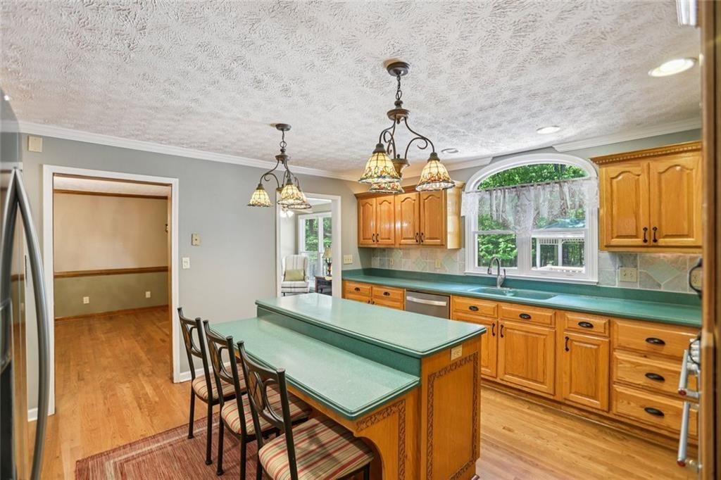 13597 Woolsey Road Hampton, GA 30228 - Photo 23 of 87 a dining room with furniture and window