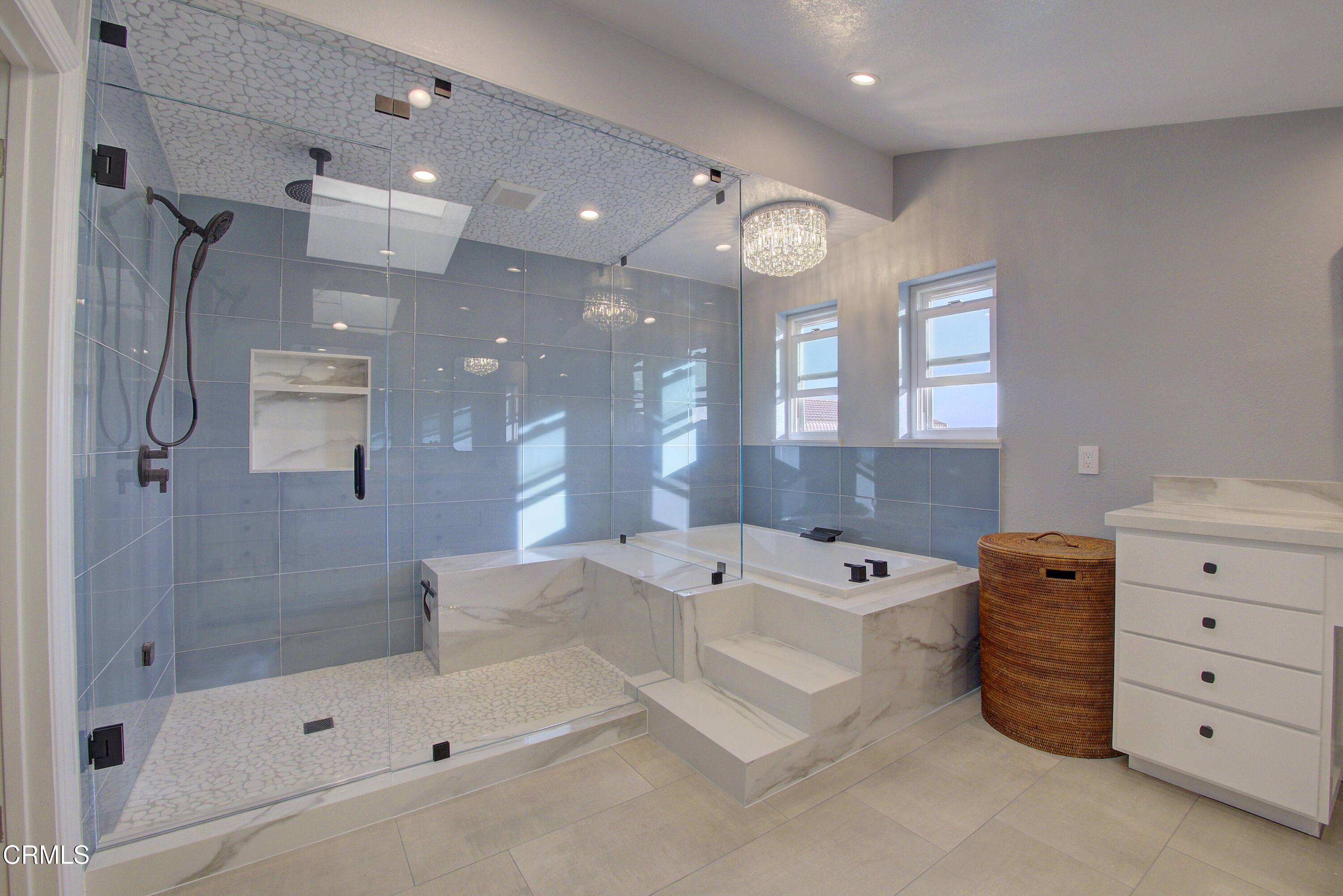 4117 Sunset Lane Oxnard, CA 93035 - Photo 15 of 33 a bathroom with a bath tub sink shower and mirror