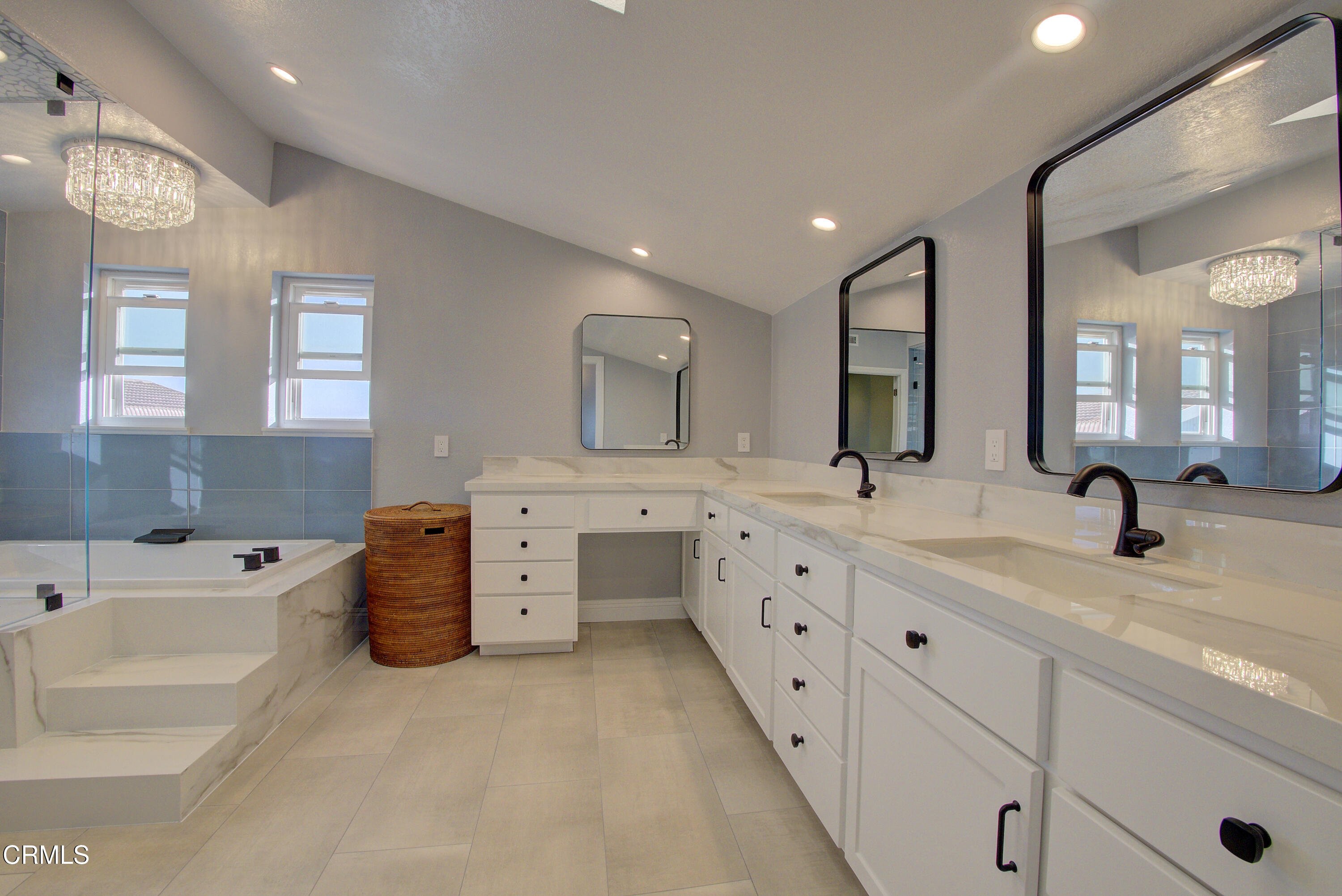 4117 Sunset Lane Oxnard, CA 93035 - Photo 16 of 33 a spacious bathroom with double sink and a large mirror