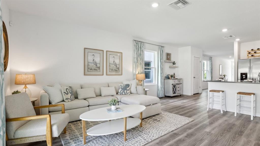 1046 Spotted Egret Loop Ruskin, FL 33570 - Photo 8 of 37 a living room with furniture and kitchen view