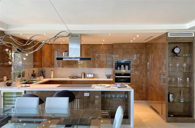 a kitchen with stainless steel appliances a stove a sink and a microwave