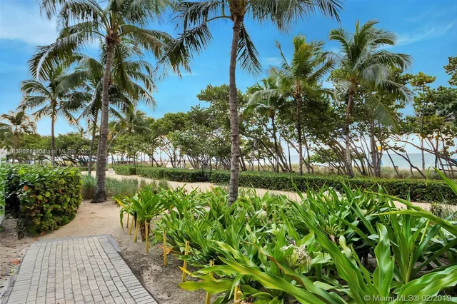 a backyard of a house with outdoor seating