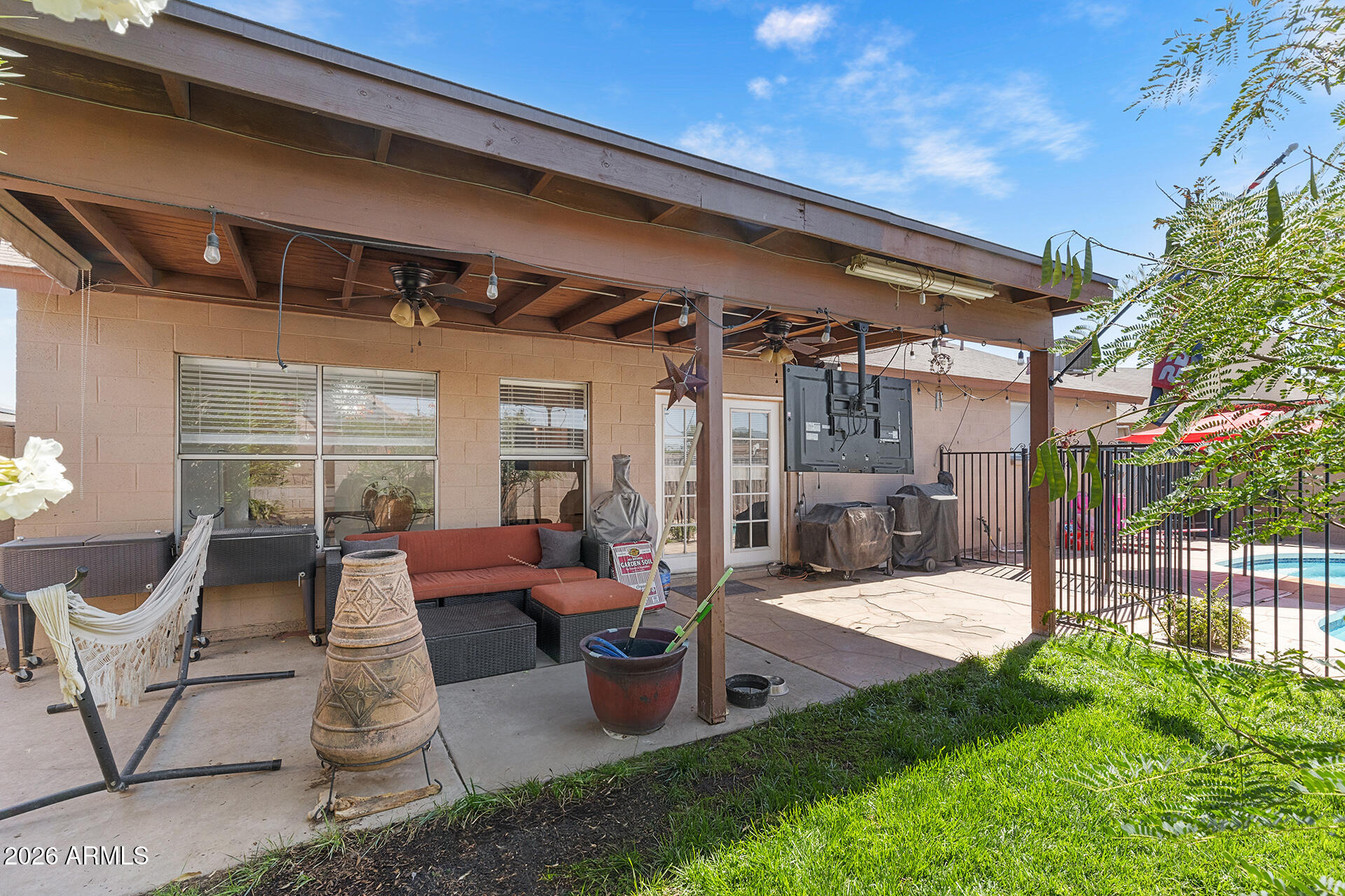 9002 West Coronado Road Phoenix, AZ 85037 - Photo 48 of 54 a building outdoor space with patio furniture and potted plants