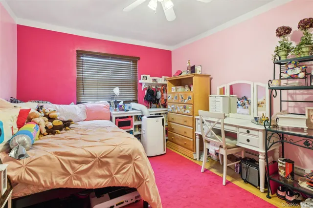 a bedroom with furniture and a baby crib