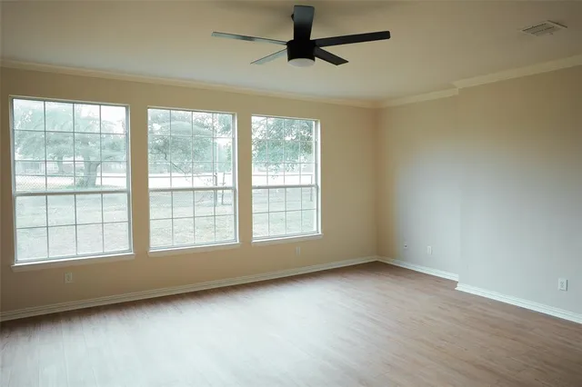 a view of an empty room and window