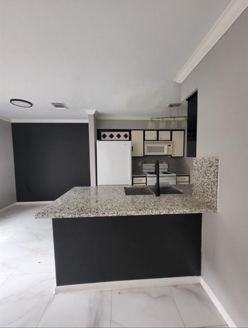 2211 South Kirkwood Road, Unit 69 Houston, TX 77077 - Photo 11 of 23 a view of a kitchen counter top space