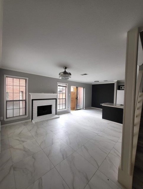 2211 South Kirkwood Road, Unit 69 Houston, TX 77077 - Photo 2 of 23 an empty room with windows and fireplace