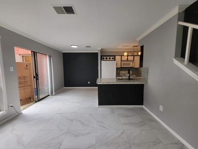 2211 South Kirkwood Road, Unit 69 Houston, TX 77077 - Photo 6 of 23 a view of kitchen with refrigerator and window