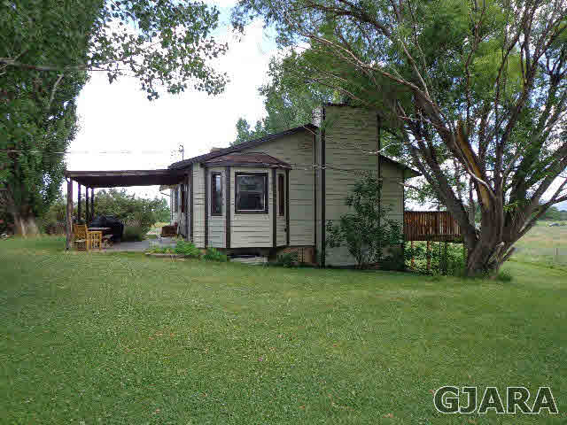 1740 North 3/10 Road Fruita, CO 81521 - Photo 3 of 20 a view of a back yard of the house