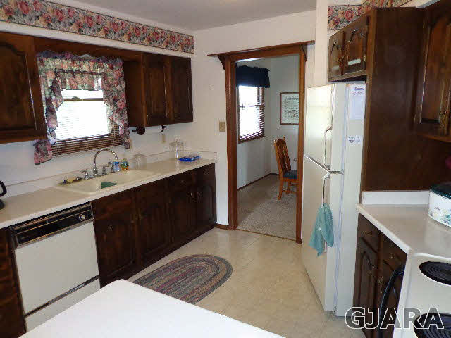 1740 North 3/10 Road Fruita, CO 81521 - Photo 8 of 20 a bathroom with a sink a vanity and a mirror