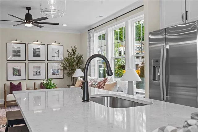 a view of living room with furniture and a large window