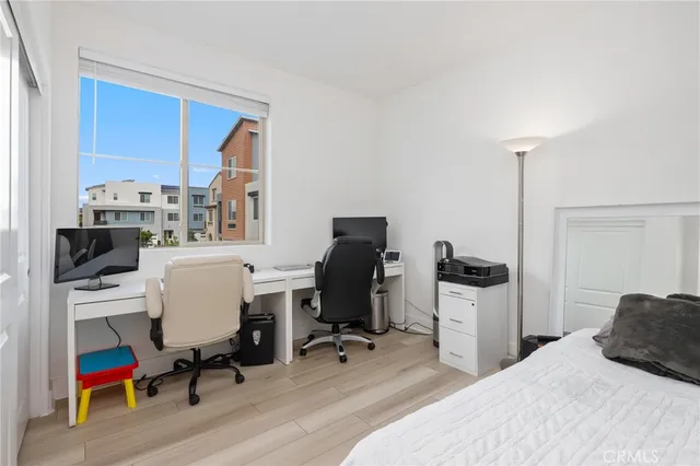 a bedroom with a workspace