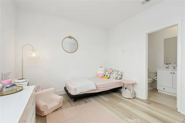 a bedroom with a bed and cabinets