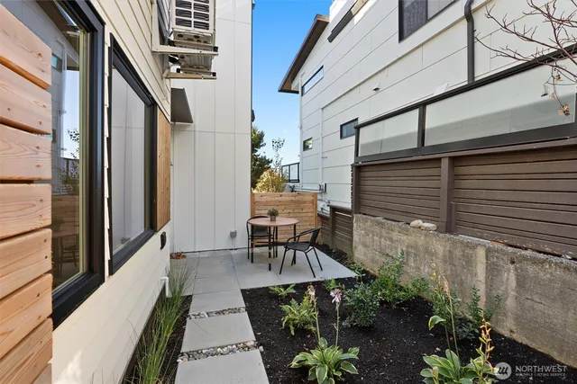 a balcony with table and chairs