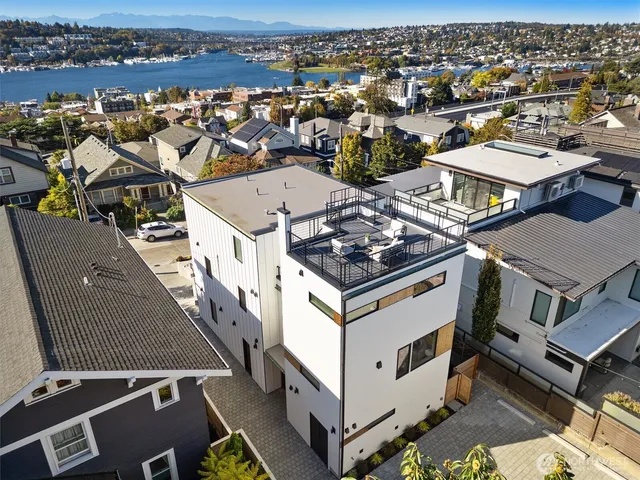 an aerial view of a house with a ocean view