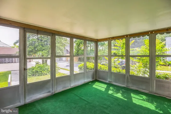 a view of an empty room with a large window