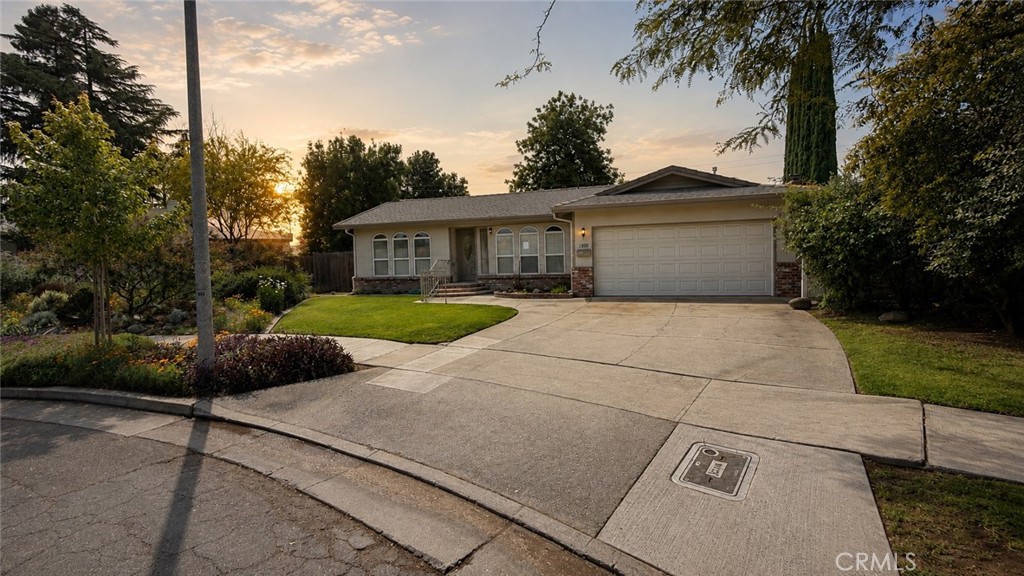 1300 Kensington Drive Merced, CA 95340 - Photo 1 of 10 a view of a house with a backyard