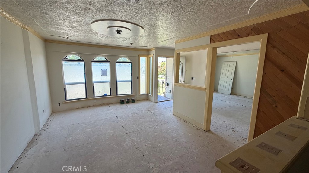 1300 Kensington Drive Merced, CA 95340 - Photo 3 of 10 an empty room with windows