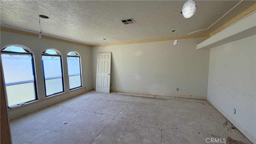 1300 Kensington Drive Merced, CA 95340 - Photo 4 of 10 a view of an empty room with windows