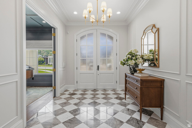 115 East Hidden Ridge Lane, Unit 42 Mapleton, UT 84664 - Photo 5 of 103 Foyer featuring checkered flooring, arched double doors with frosted glass, crown molding, and recessed lighting