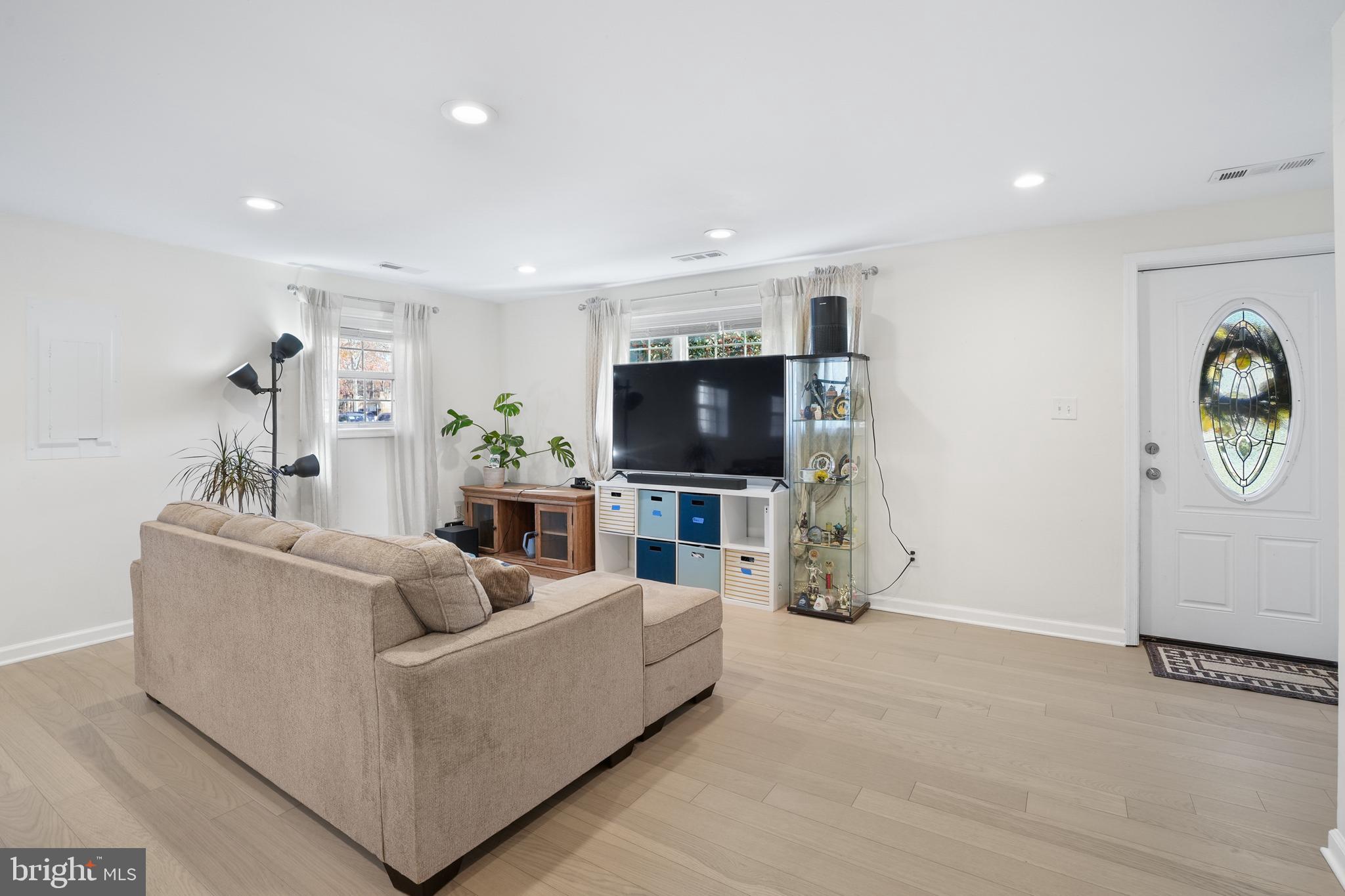 15709 Maple Drive Accokeek, MD 20607 - Photo 13 of 48 a living room with furniture and a flat screen tv