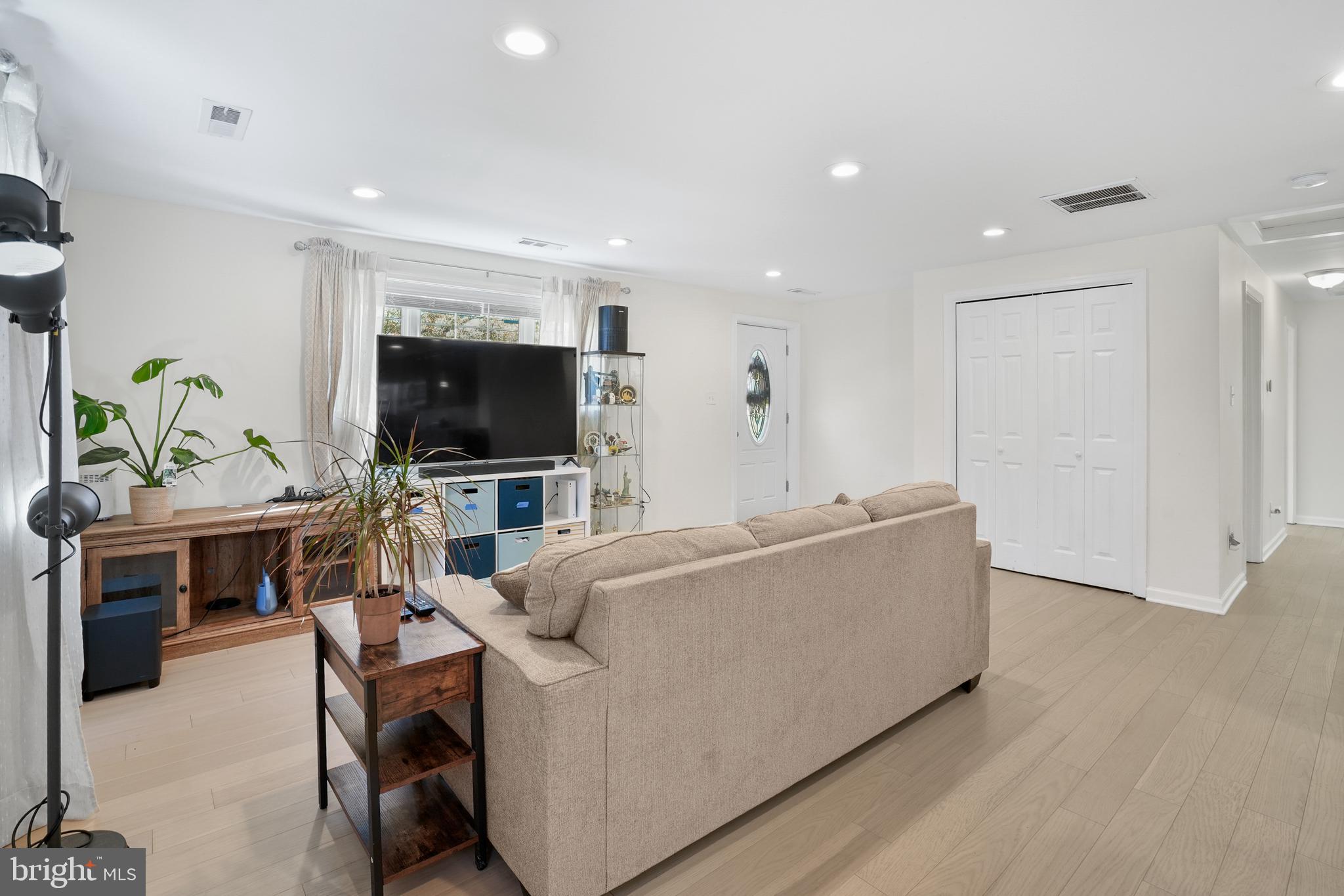 15709 Maple Drive Accokeek, MD 20607 - Photo 15 of 48 a living room with furniture and a flat screen tv