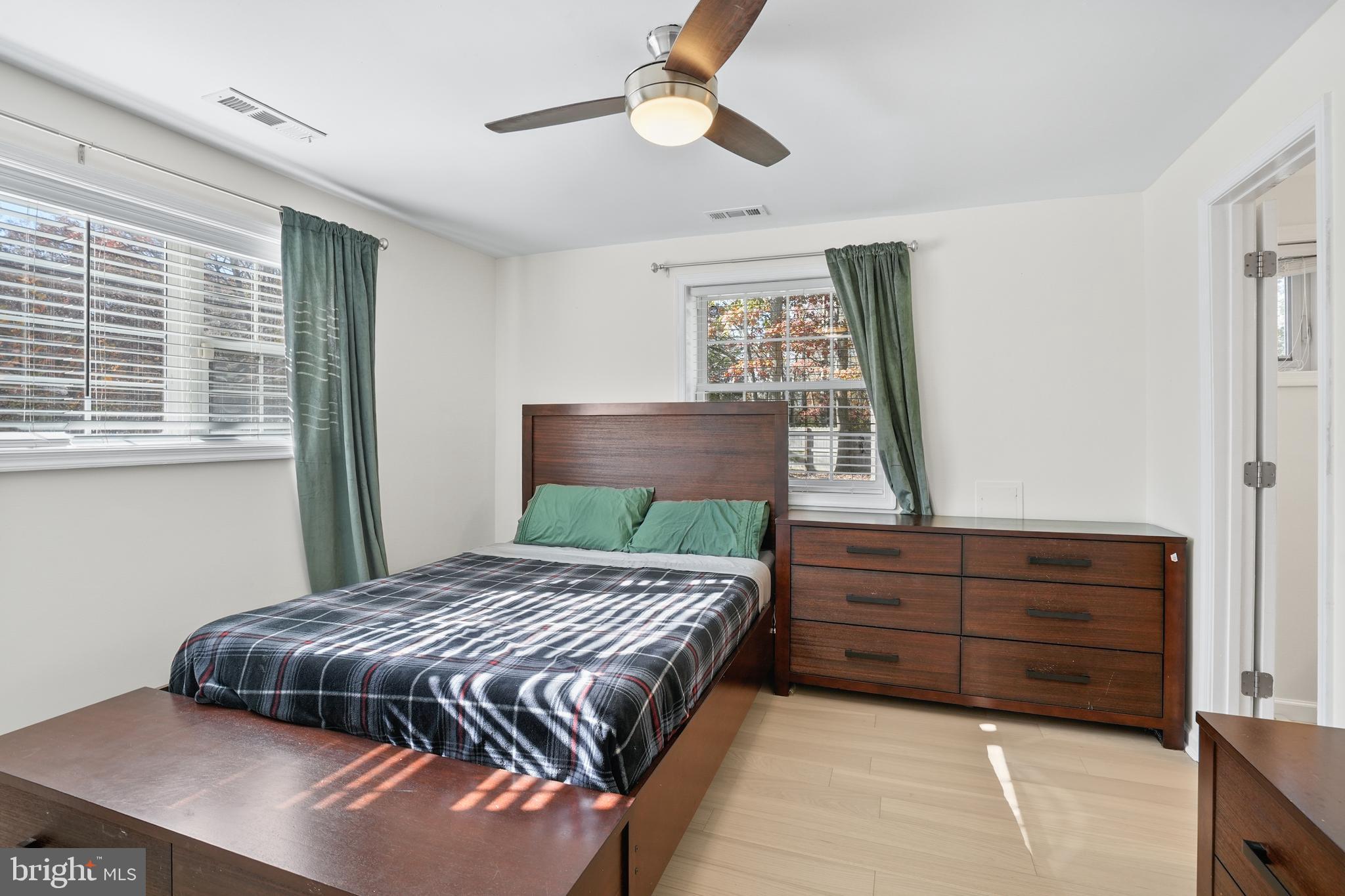 15709 Maple Drive Accokeek, MD 20607 - Photo 25 of 48 a bedroom with a bed dresser and window