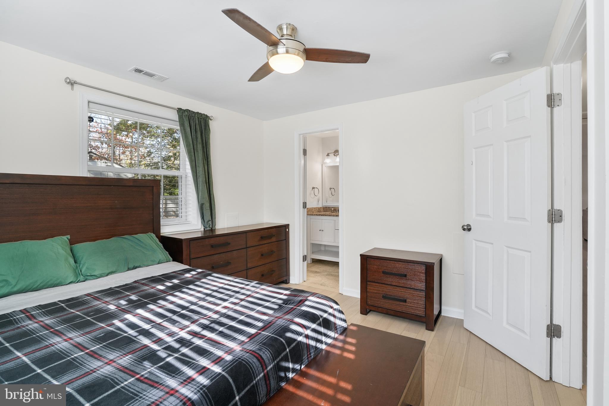 15709 Maple Drive Accokeek, MD 20607 - Photo 26 of 48 a bedroom with a bed and a window