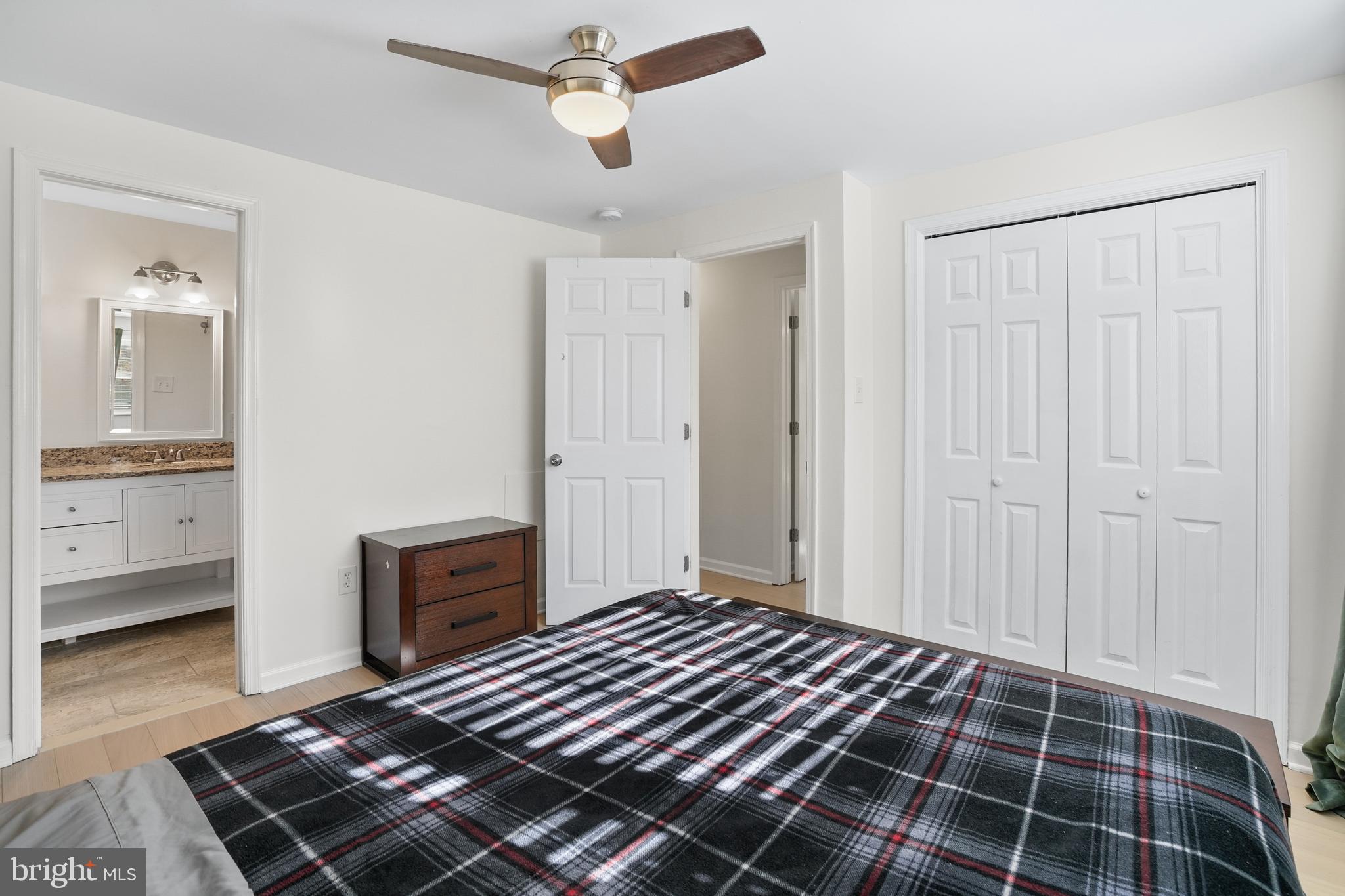15709 Maple Drive Accokeek, MD 20607 - Photo 27 of 48 a bedroom with a bed and a view of kitchen