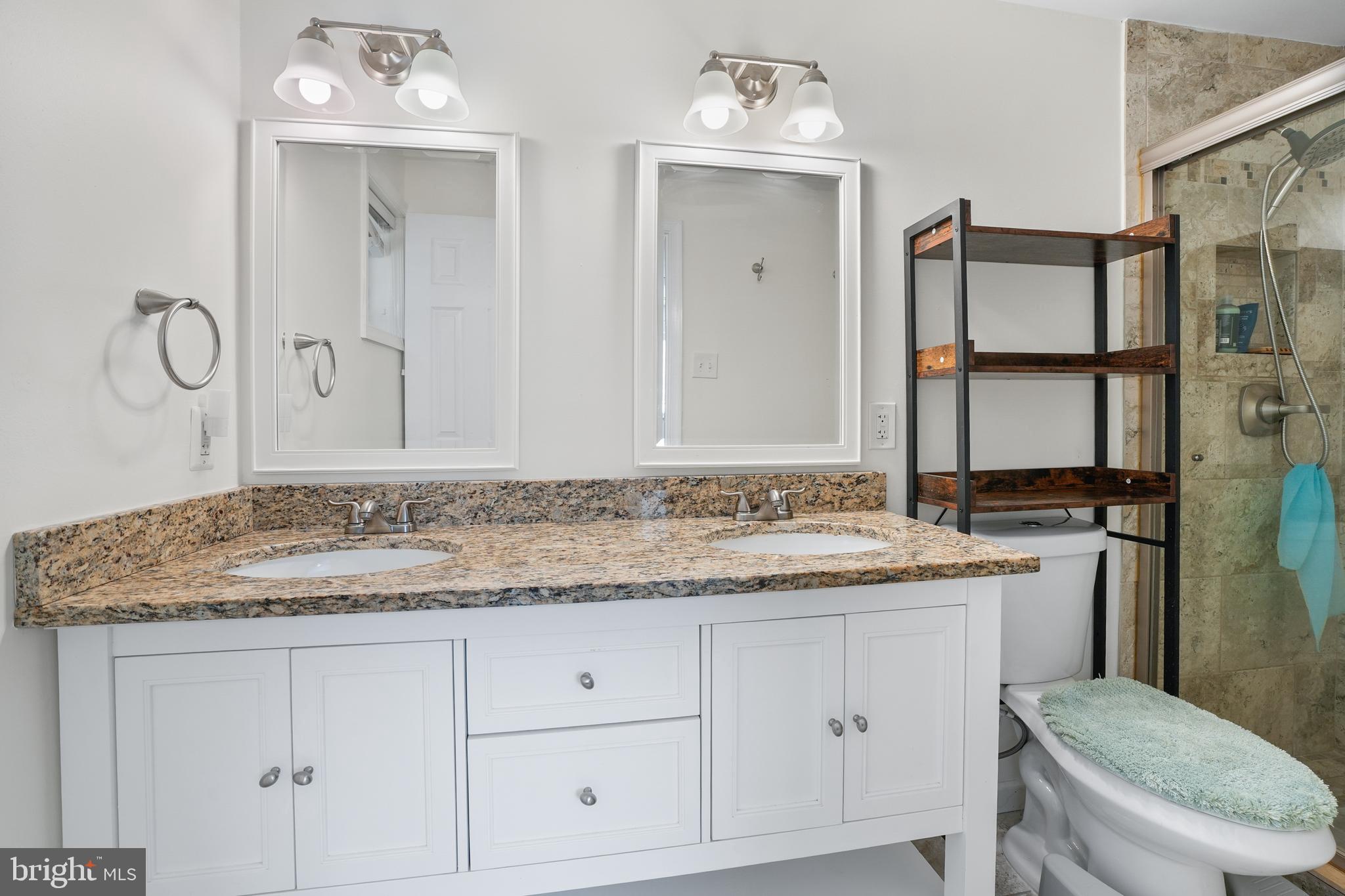 15709 Maple Drive Accokeek, MD 20607 - Photo 28 of 48 a bathroom with a granite countertop sink vanity mirror and toilet