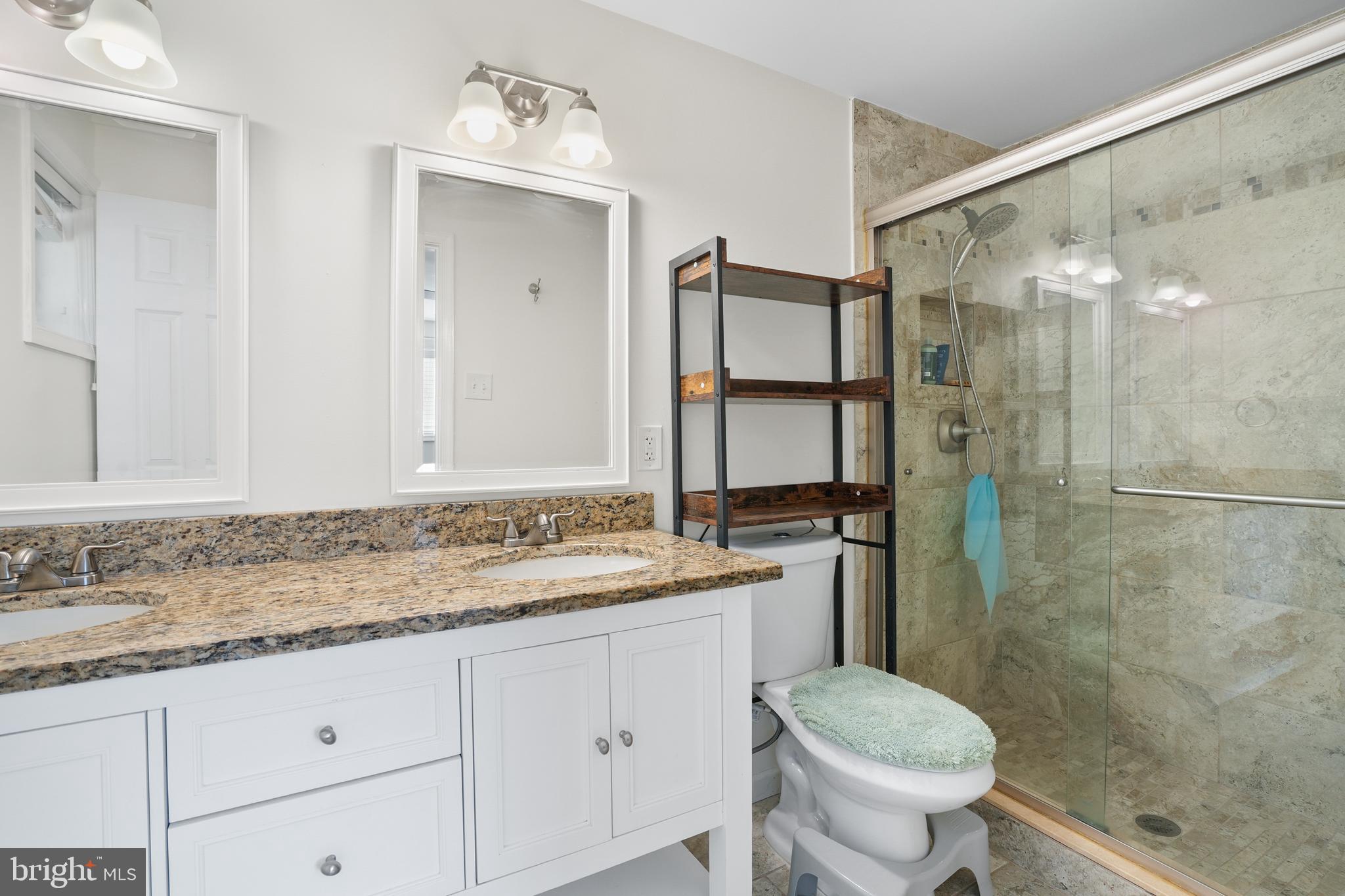 15709 Maple Drive Accokeek, MD 20607 - Photo 29 of 48 a bathroom with a sink and a mirror