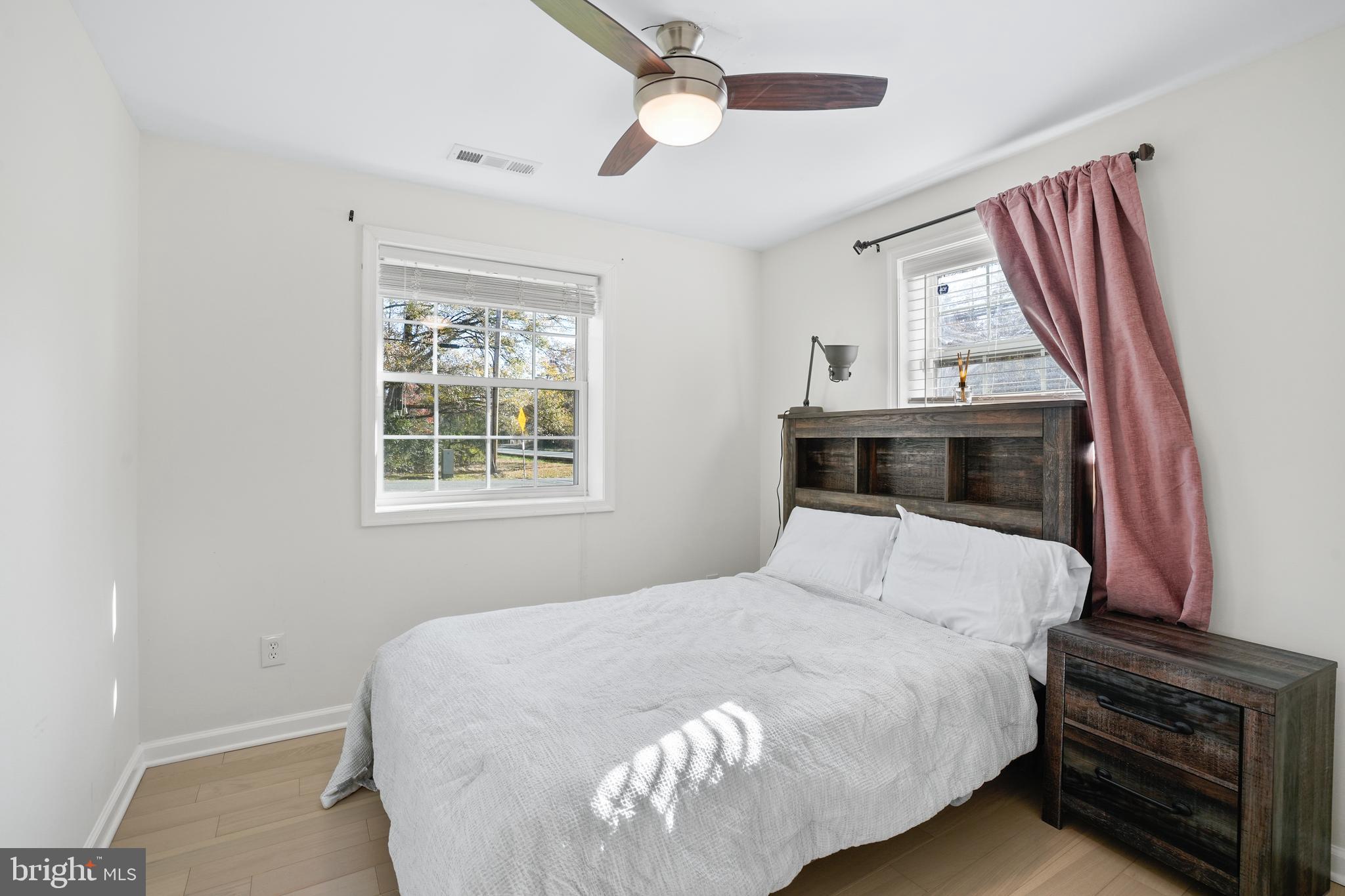 15709 Maple Drive Accokeek, MD 20607 - Photo 31 of 48 a bedroom with a bed and a window