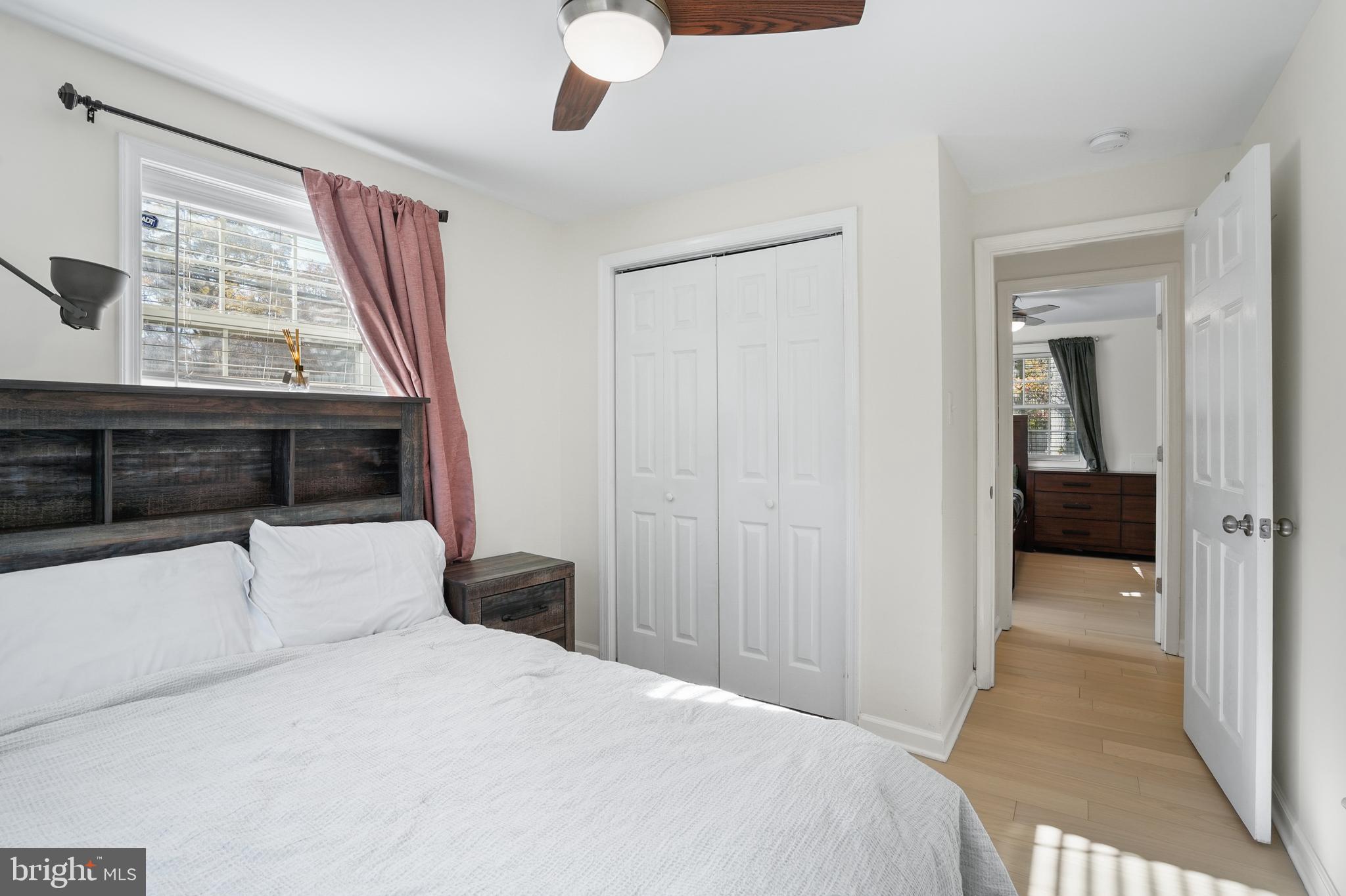 15709 Maple Drive Accokeek, MD 20607 - Photo 32 of 48 a bedroom with a bed and a window