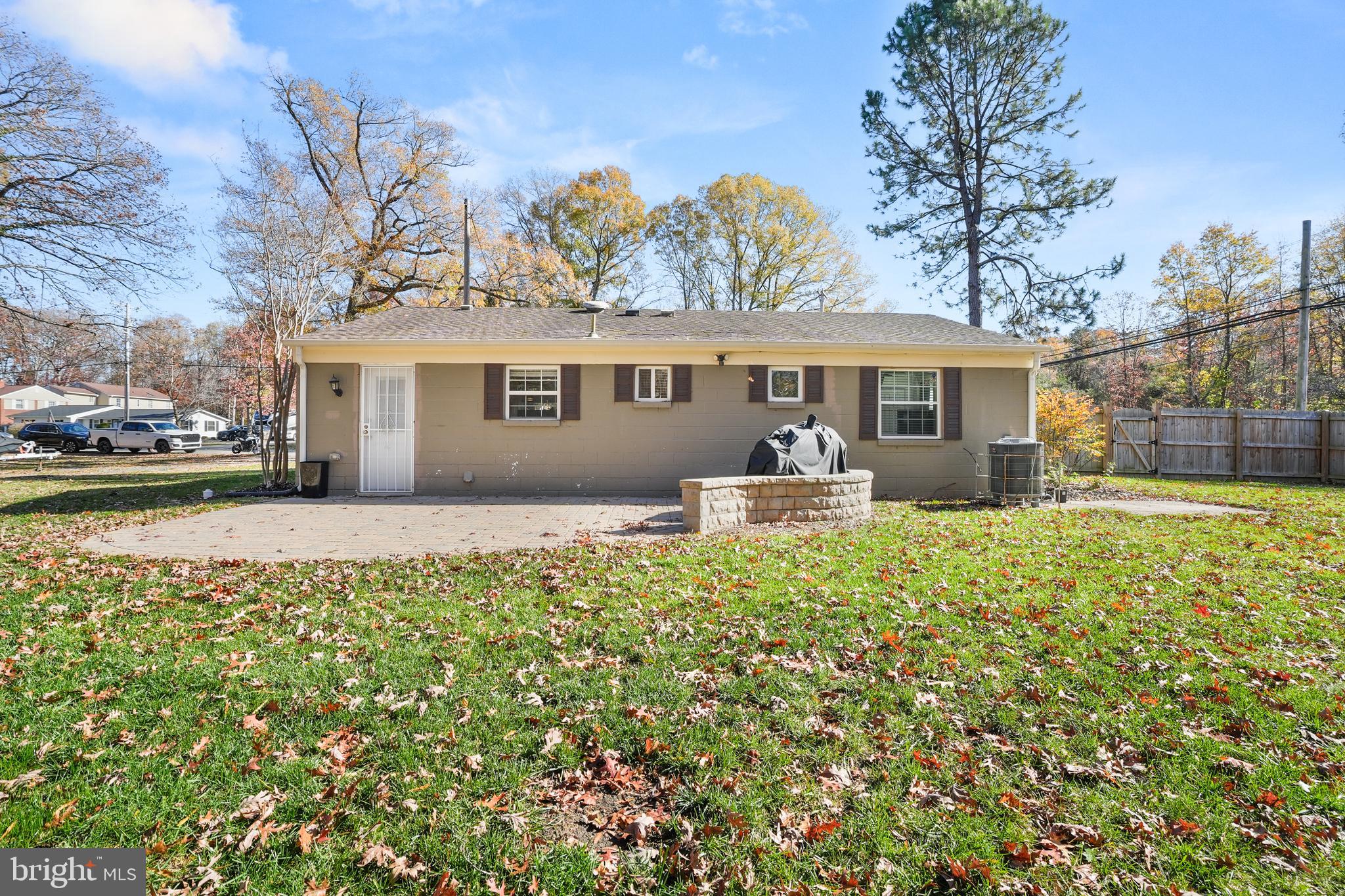 15709 Maple Drive Accokeek, MD 20607 - Photo 4 of 48 a front view of a house with a yard and potted plants