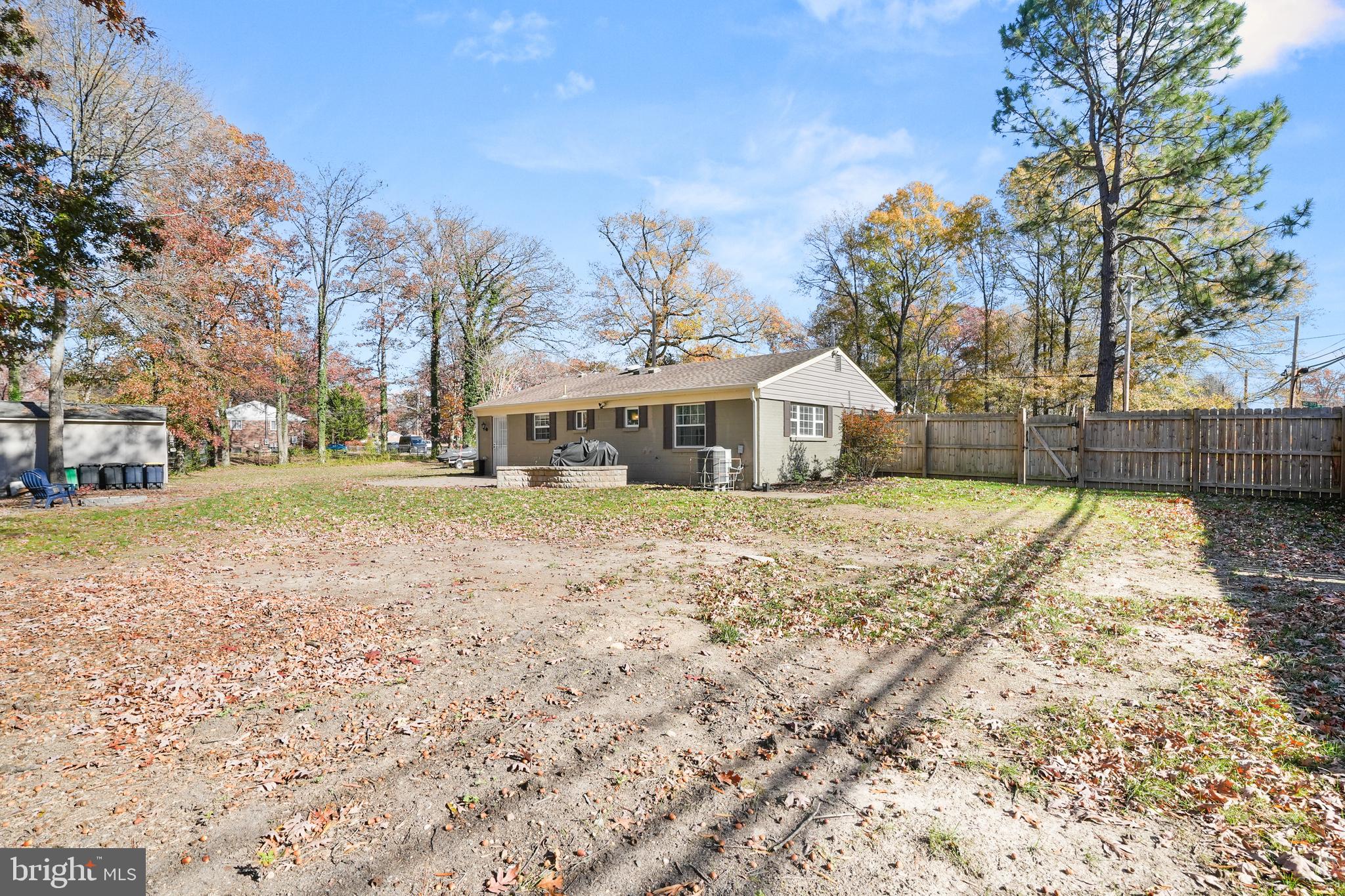 15709 Maple Drive Accokeek, MD 20607 - Photo 43 of 48 a house with large trees in front of it