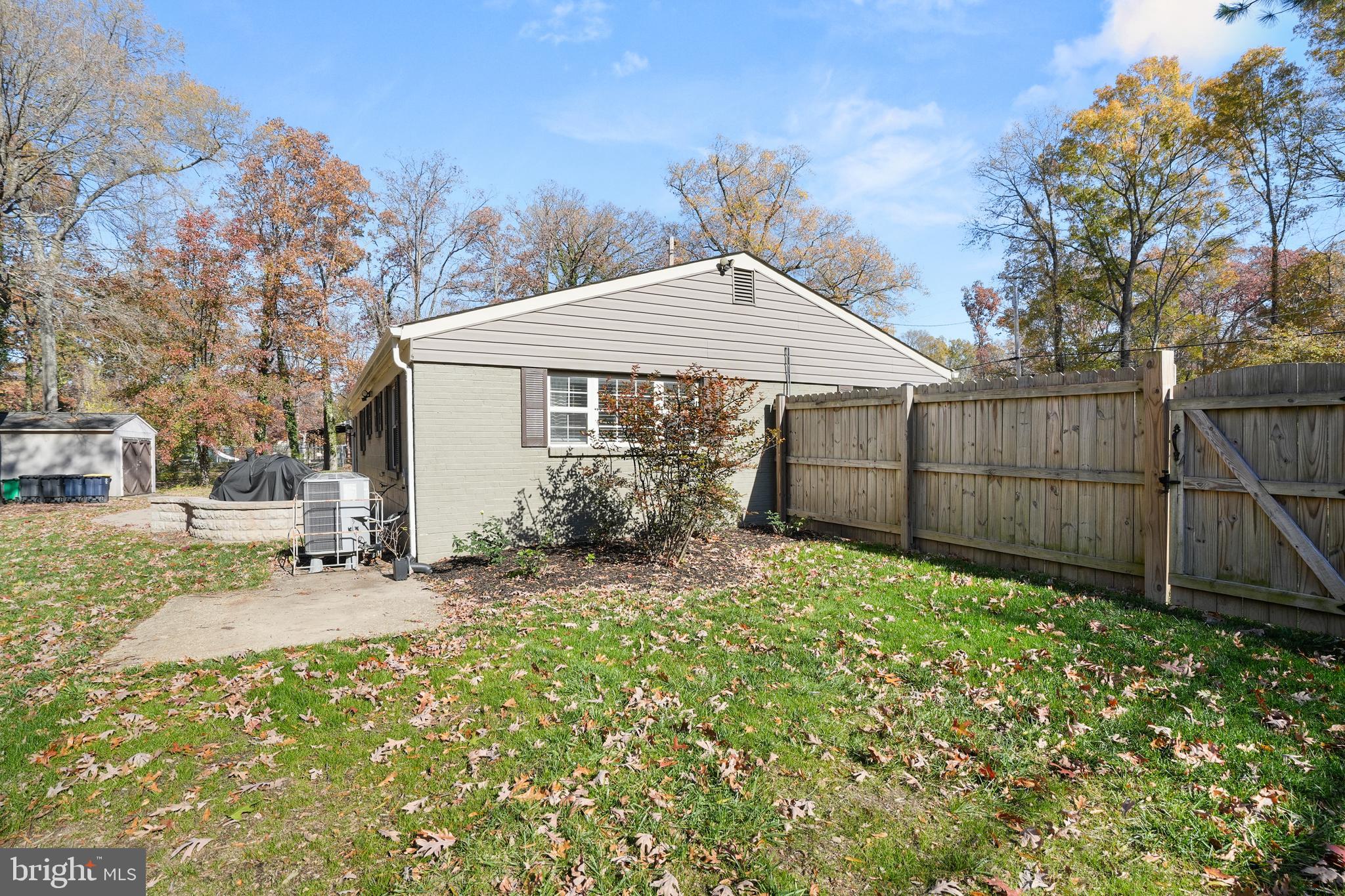 15709 Maple Drive Accokeek, MD 20607 - Photo 44 of 48 a backyard of a house with table and chairs