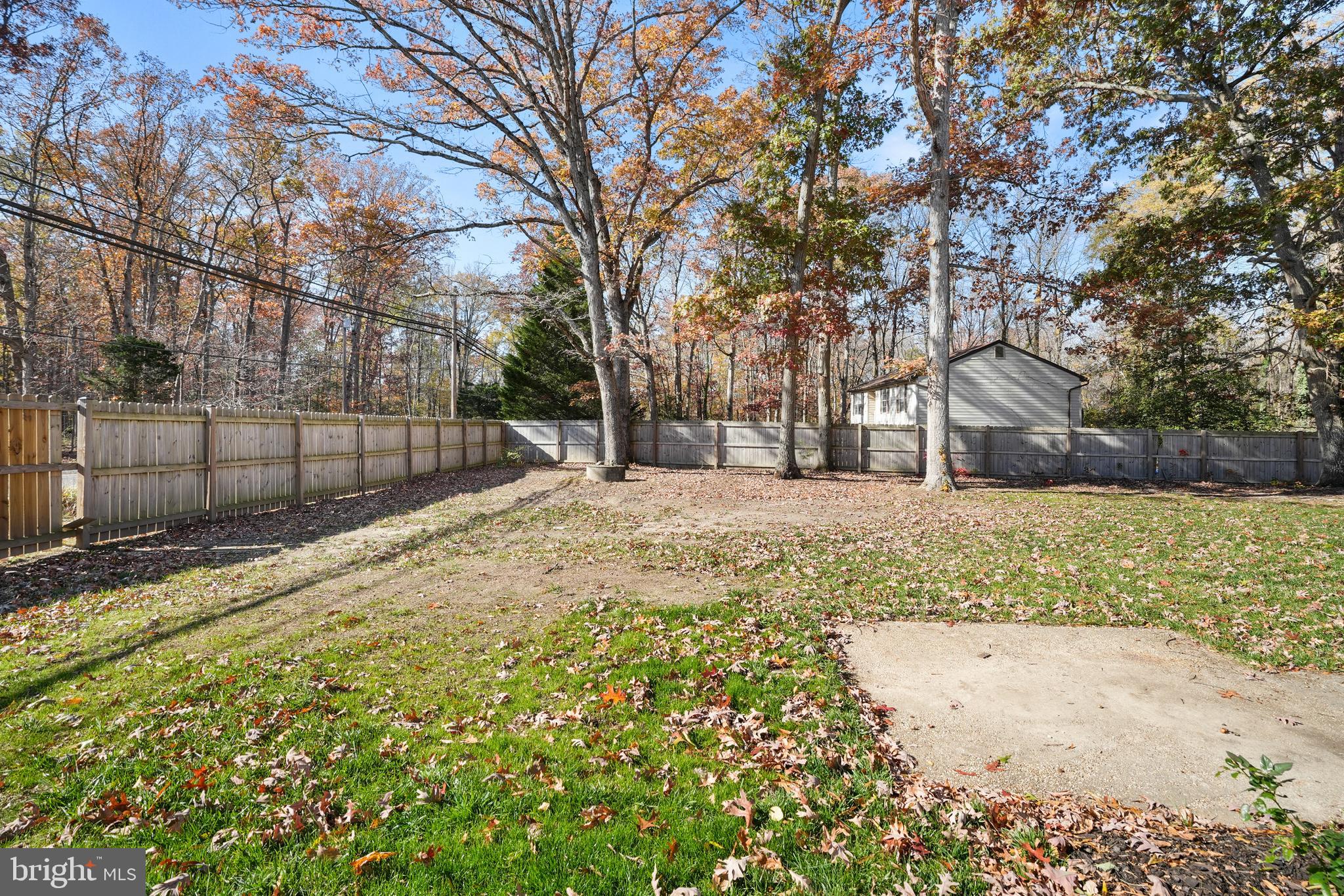 15709 Maple Drive Accokeek, MD 20607 - Photo 45 of 48 a view of a yard covered with snow in front of house