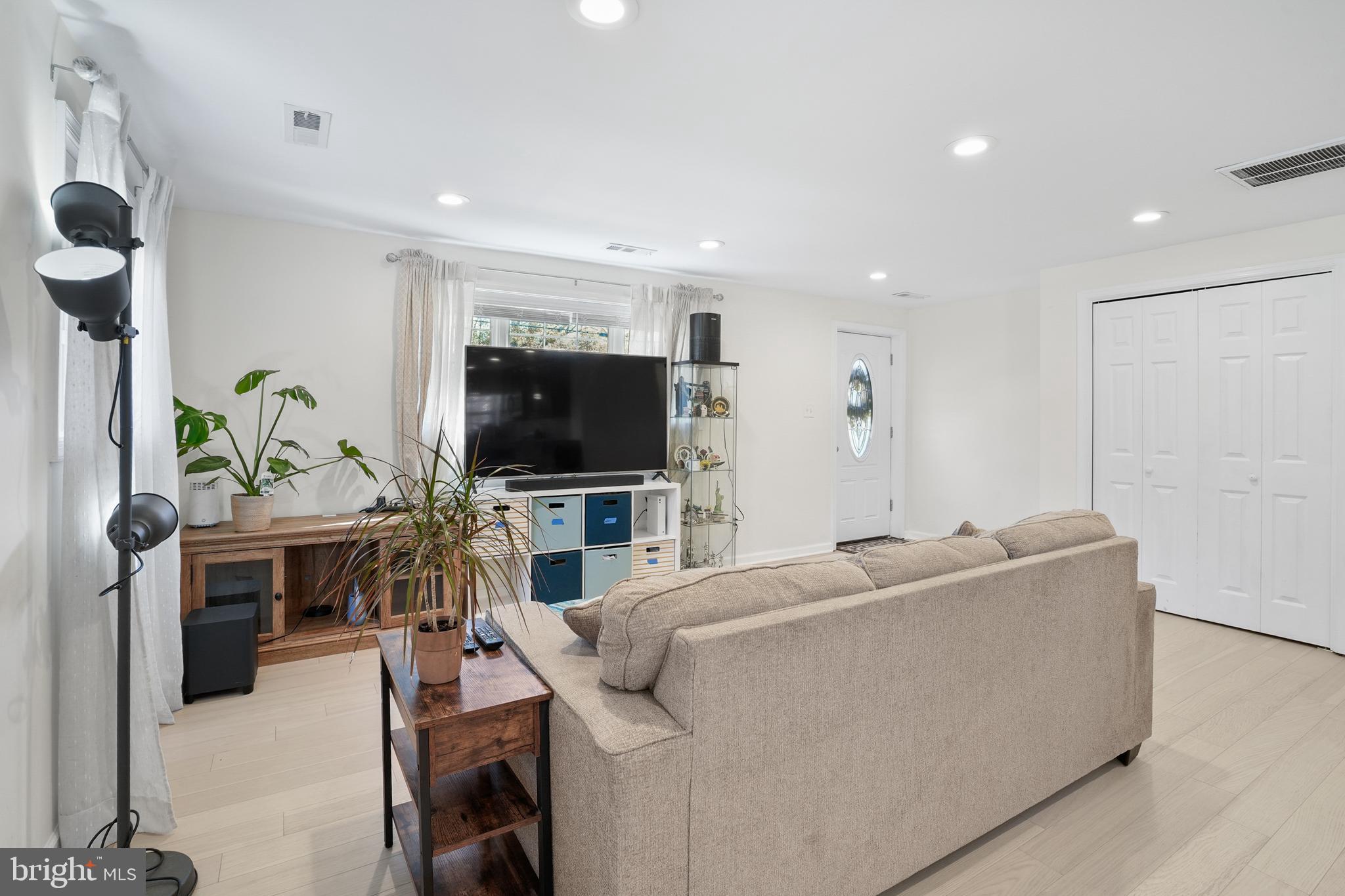 15709 Maple Drive Accokeek, MD 20607 - Photo 10 of 48 a living room with furniture and a flat screen tv